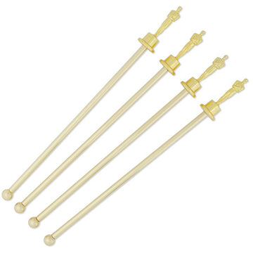 Set of four gold-colored swizzle sticks on a white background